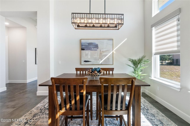 dining space featuring a notable chandelier