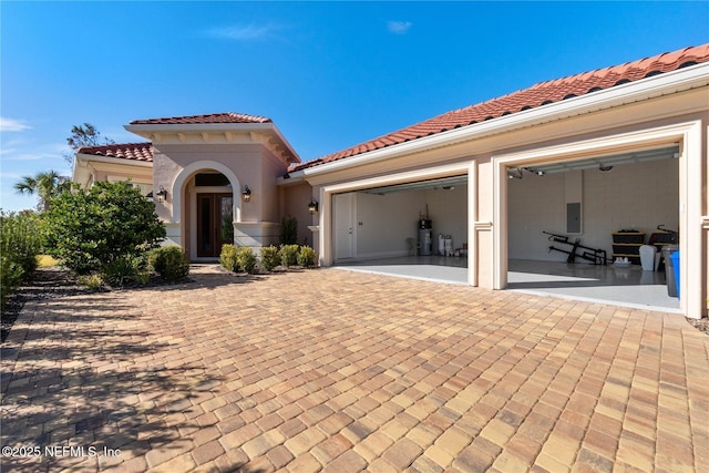 mediterranean / spanish house featuring a garage