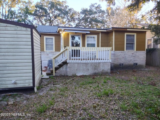 view of front of property with a deck