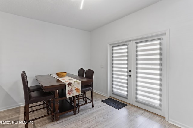 dining space featuring light hardwood / wood-style flooring