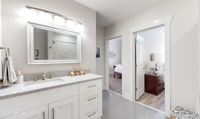 bathroom with tile patterned floors and vanity