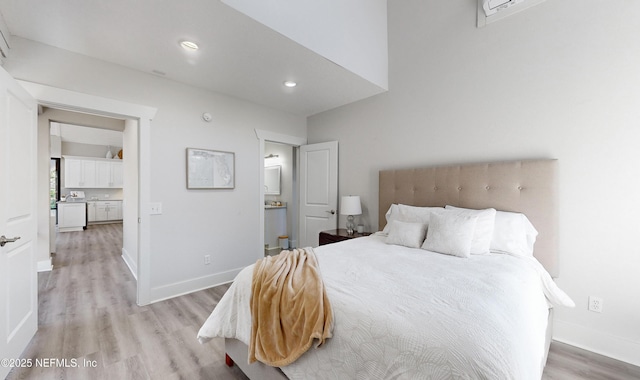 bedroom with light hardwood / wood-style floors