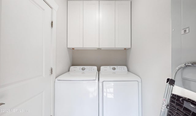 laundry room with cabinets and separate washer and dryer