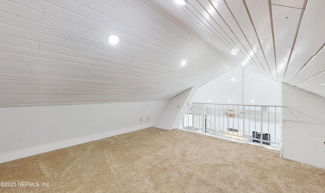 bonus room with wooden ceiling, vaulted ceiling, and carpet flooring