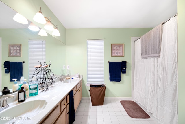 bathroom featuring tile patterned flooring and vanity