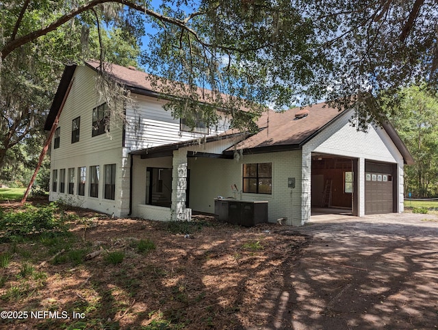 view of property exterior with a garage