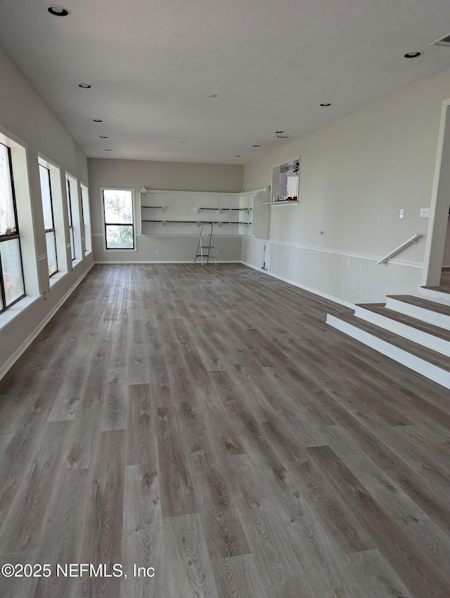 unfurnished living room featuring hardwood / wood-style flooring