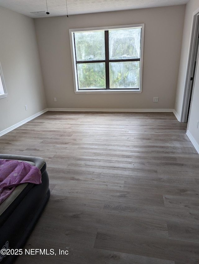 unfurnished bedroom featuring light hardwood / wood-style floors