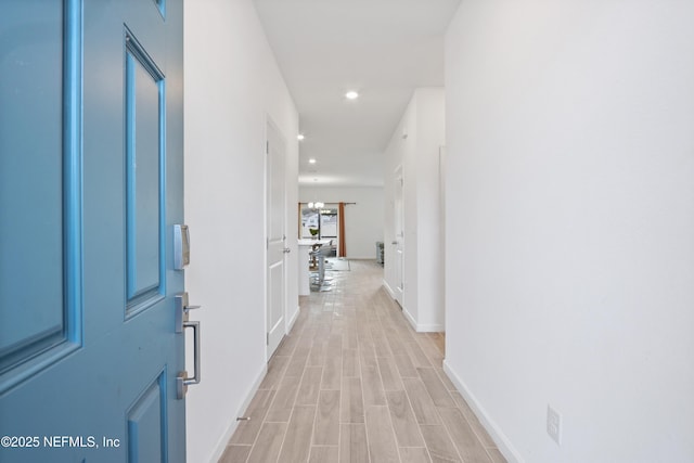 corridor with light wood-type flooring