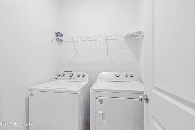 washroom featuring washer and dryer and laundry area