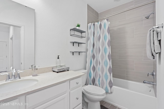 full bathroom with shower / tub combo with curtain, vanity, and toilet