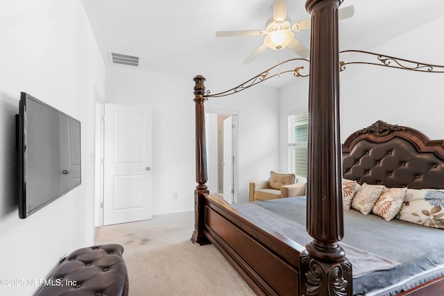 bedroom featuring light colored carpet and ceiling fan