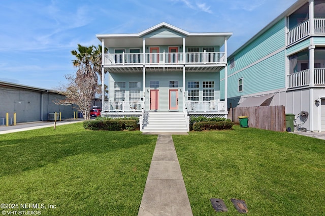 view of front of home featuring central AC unit and a front yard