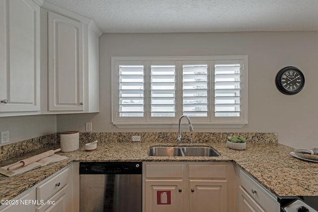 kitchen featuring white cabinetry, a healthy amount of sunlight, dishwasher, and sink