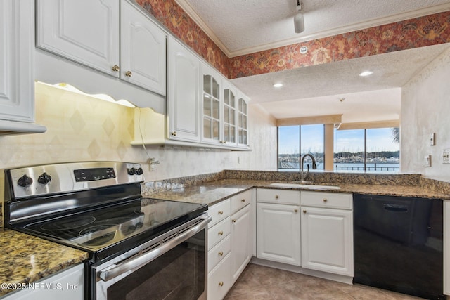 kitchen featuring sink, dark stone countertops, black dishwasher, electric stove, and white cabinets