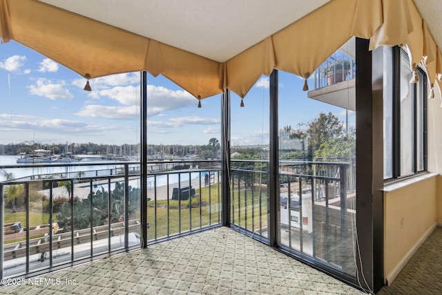 balcony featuring a water view