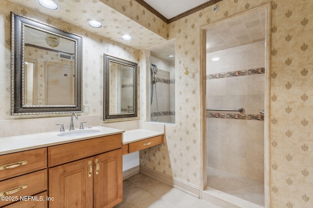 bathroom featuring vanity and a tile shower