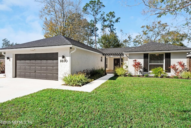 ranch-style home with a front yard and a garage