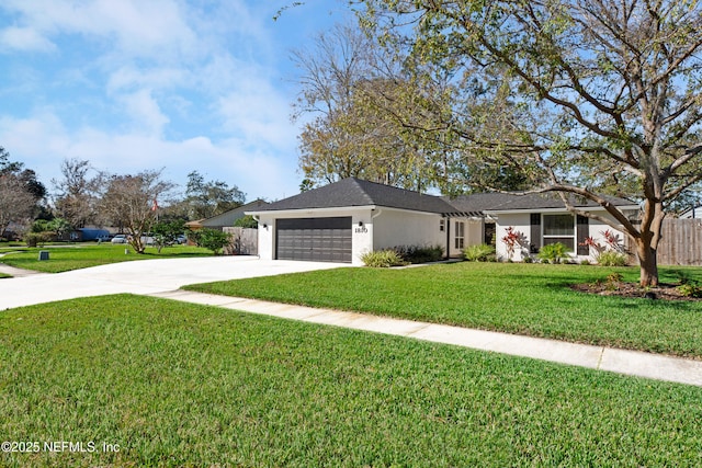 ranch-style house with a front yard and a garage