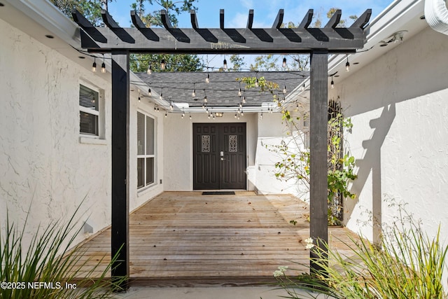 property entrance featuring a wooden deck