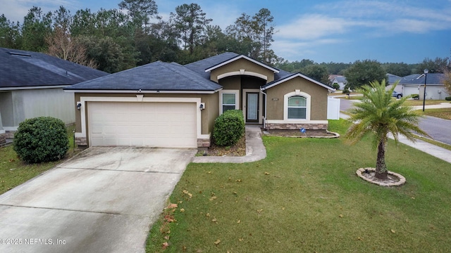 ranch-style house featuring a front lawn and a garage