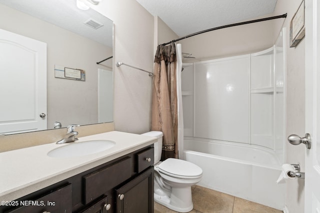 full bathroom with vanity, a textured ceiling, shower / bathtub combination with curtain, tile patterned flooring, and toilet