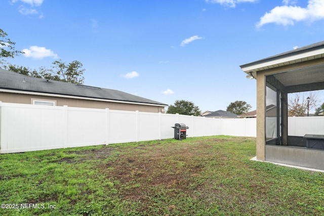 view of yard featuring a sunroom