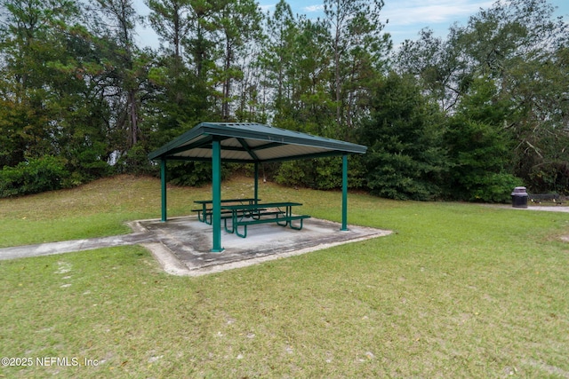 surrounding community featuring a gazebo and a lawn