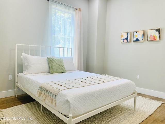 bedroom featuring hardwood / wood-style floors