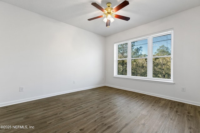 unfurnished room featuring dark hardwood / wood-style flooring and ceiling fan