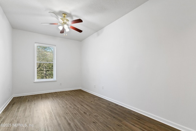 unfurnished room featuring ceiling fan and dark hardwood / wood-style floors