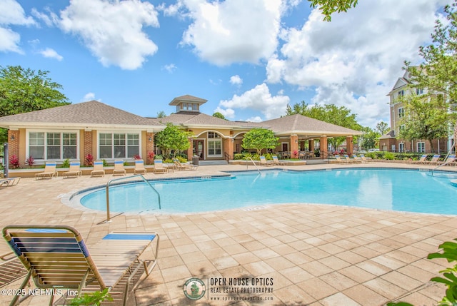 view of swimming pool featuring a patio area