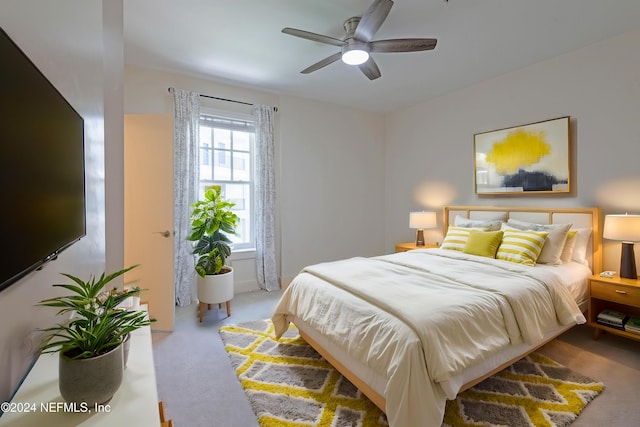 bedroom with ceiling fan and carpet floors