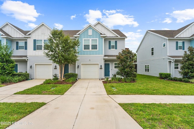 multi unit property with a front yard and a garage