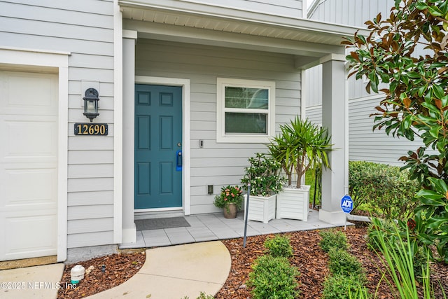 doorway to property with a porch