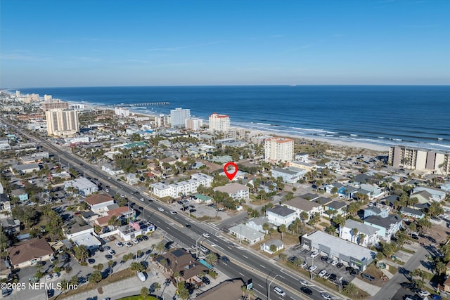 drone / aerial view with a view of the beach and a water view