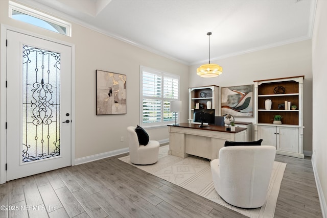 office space with crown molding and light hardwood / wood-style floors