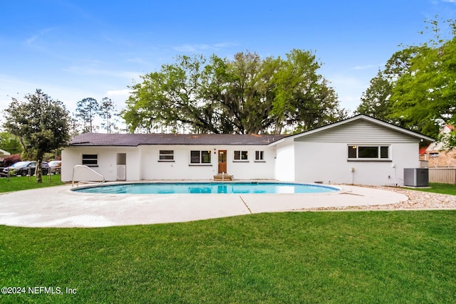 view of pool featuring a patio area, a yard, and cooling unit