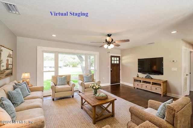 living room featuring wood-type flooring and ceiling fan