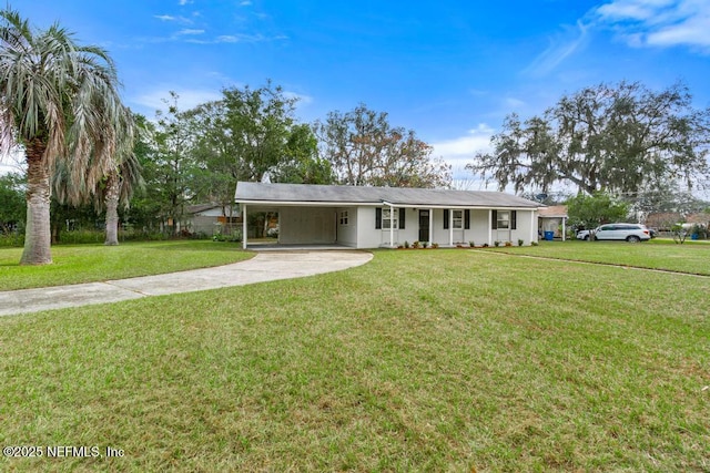 ranch-style house featuring a front yard and a carport