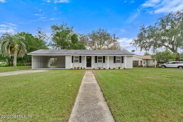 ranch-style home with a carport and a front lawn