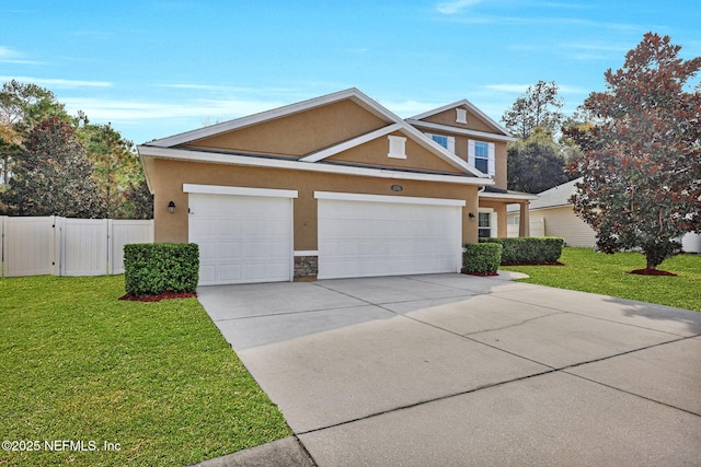 view of front of house with a front yard and a garage