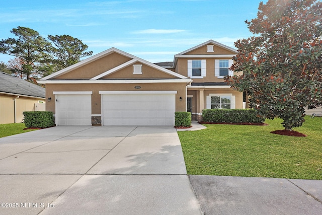 view of front facade with a front yard and a garage