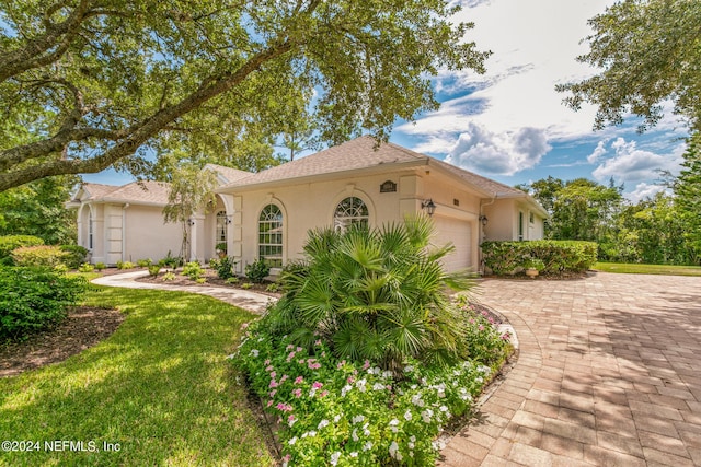 mediterranean / spanish house with a garage