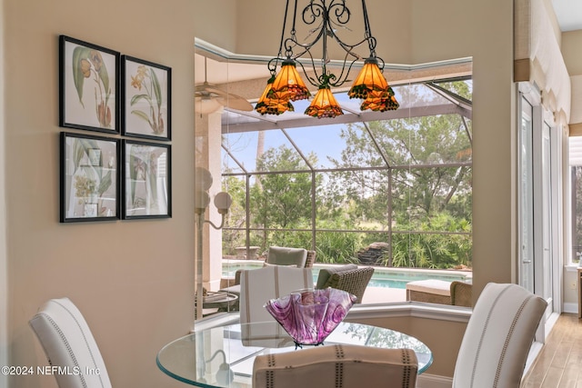 dining area with light hardwood / wood-style floors and a wealth of natural light