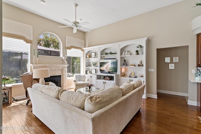 living room with ceiling fan and dark hardwood / wood-style floors