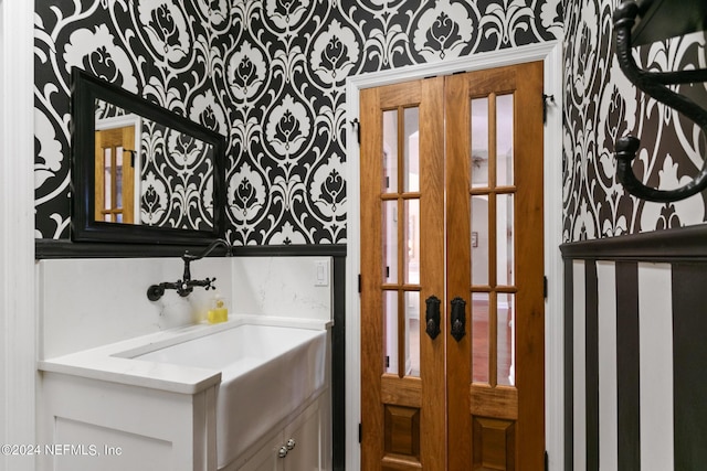 interior space featuring french doors and vanity