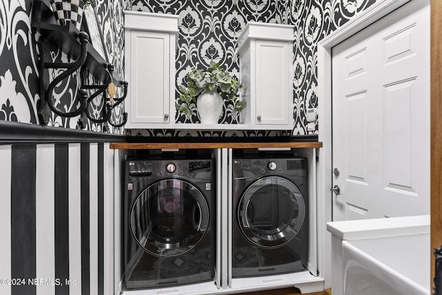 laundry area with cabinets and independent washer and dryer