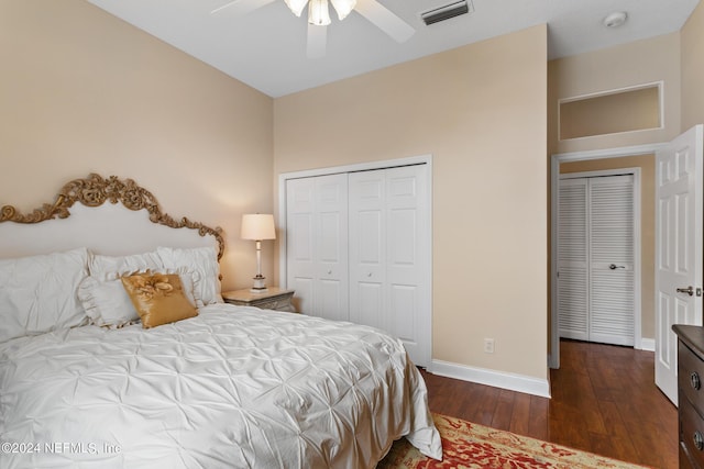 bedroom with a closet, dark hardwood / wood-style floors, and ceiling fan