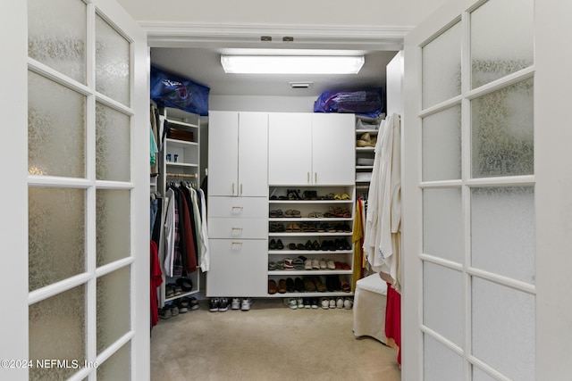 walk in closet featuring carpet